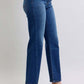 Judy Blue full-size straight jeans with unique side seam detail, styled with chic heels for a modern look.