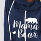 Woman wearing Bella Road Drawstring Letter Graphic Long Sleeve Hoodie with "Mama Bear" text and bear graphic in navy blue color.