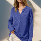 Woman wearing Double Take Full Size Notched Thumbhole Long Sleeve T-Shirt in blue