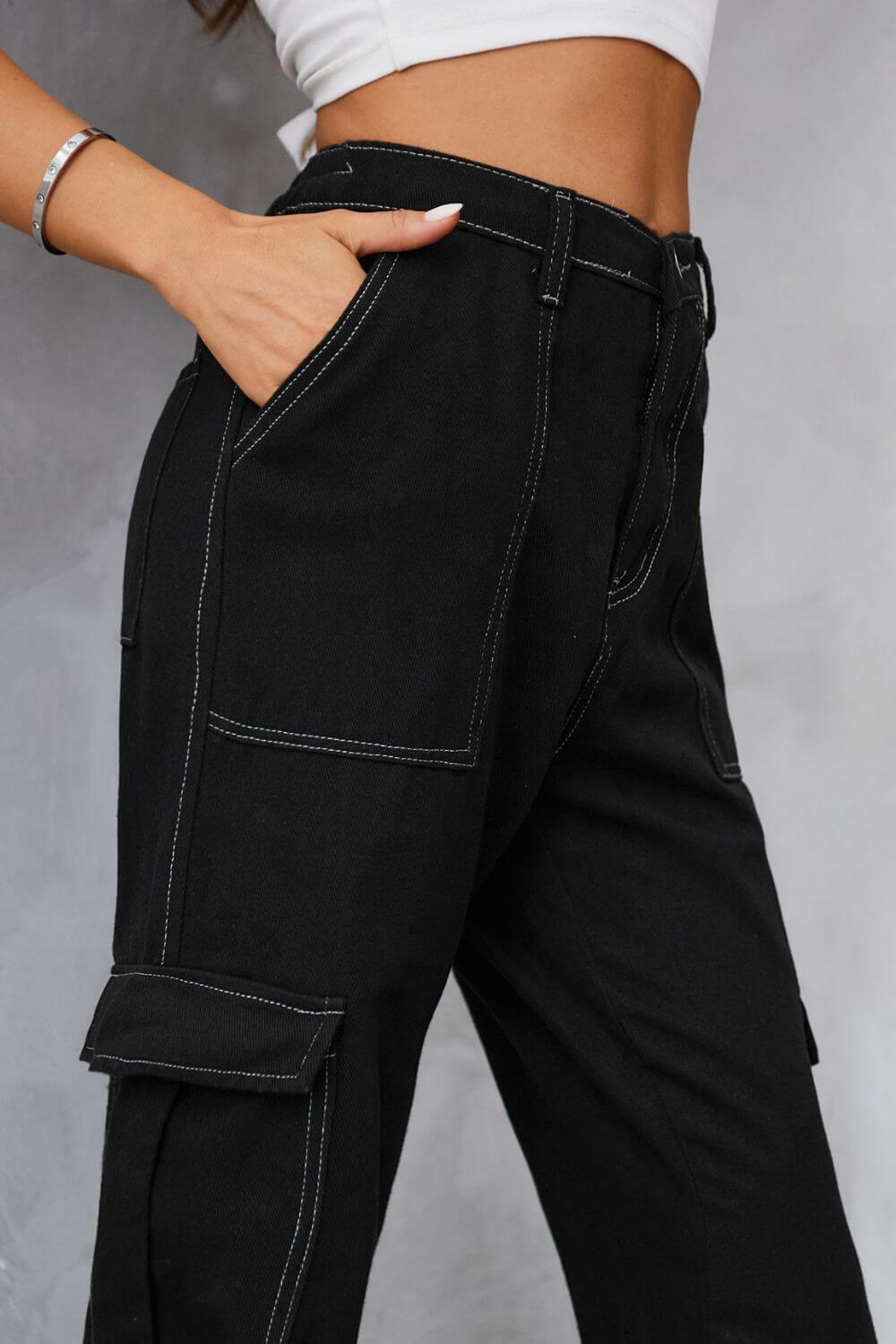 Woman wearing Baeful Long Straight Leg Jeans with Pockets in solid black, showcasing chic and casual style with flattering fit.