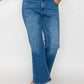 Model showcasing bytos Full Size Cat's Whiskers Mid Rise Ankle Jeans in classic blue denim, perfect for stylish outfits.