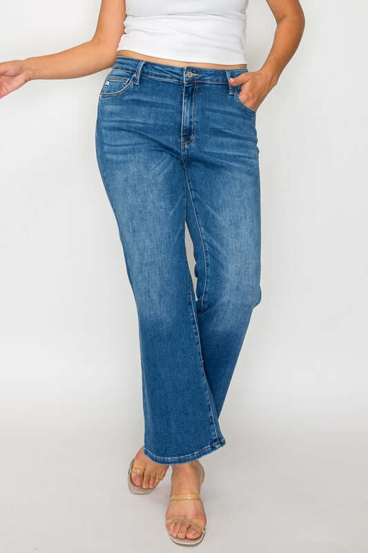 Model showcasing bytos Full Size Cat's Whiskers Mid Rise Ankle Jeans in classic blue denim, perfect for stylish outfits.