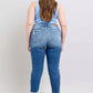 Back view of Judy Blue plus size button fly distressed jeans, showcasing the stylish fit and practical pockets.