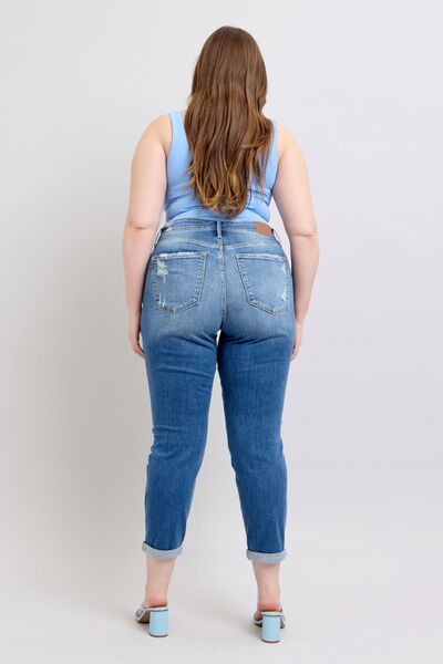 Back view of Judy Blue plus size button fly distressed jeans, showcasing the stylish fit and practical pockets.