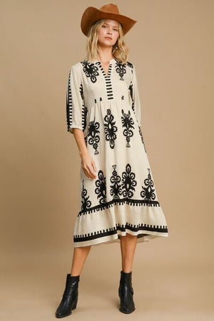 Stylish Umgee Printed Notched Midi Dress with chic print, notched neckline, and casual elegance, perfect for any occasion.