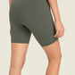 Millennia seamless high-rise wide waistband biker shorts in green, showcasing a smooth and supportive fit from the back.