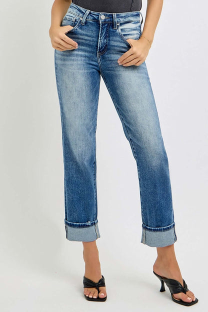 Woman wearing RISEN High Rise Crop Straight Roll Up Jeans with rolled hem, paired with black heels.