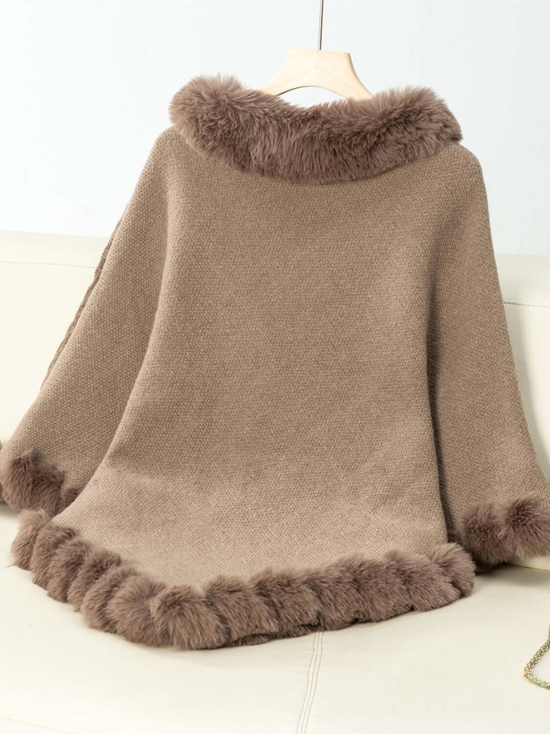 Cozy Bella Road Poncho with fuzzy trim, three-quarter sleeves, and a stylish beige texture ideal for chilly days.