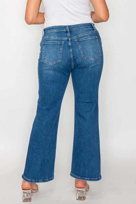 Woman wearing bytos Cat's Whiskers mid-rise ankle jeans, showcasing a flattering fit and stylish design from the back.