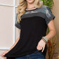 Woman wearing Color Block Round Neck Short Sleeve T-Shirt with jeans, showcasing trendy casual outfit.