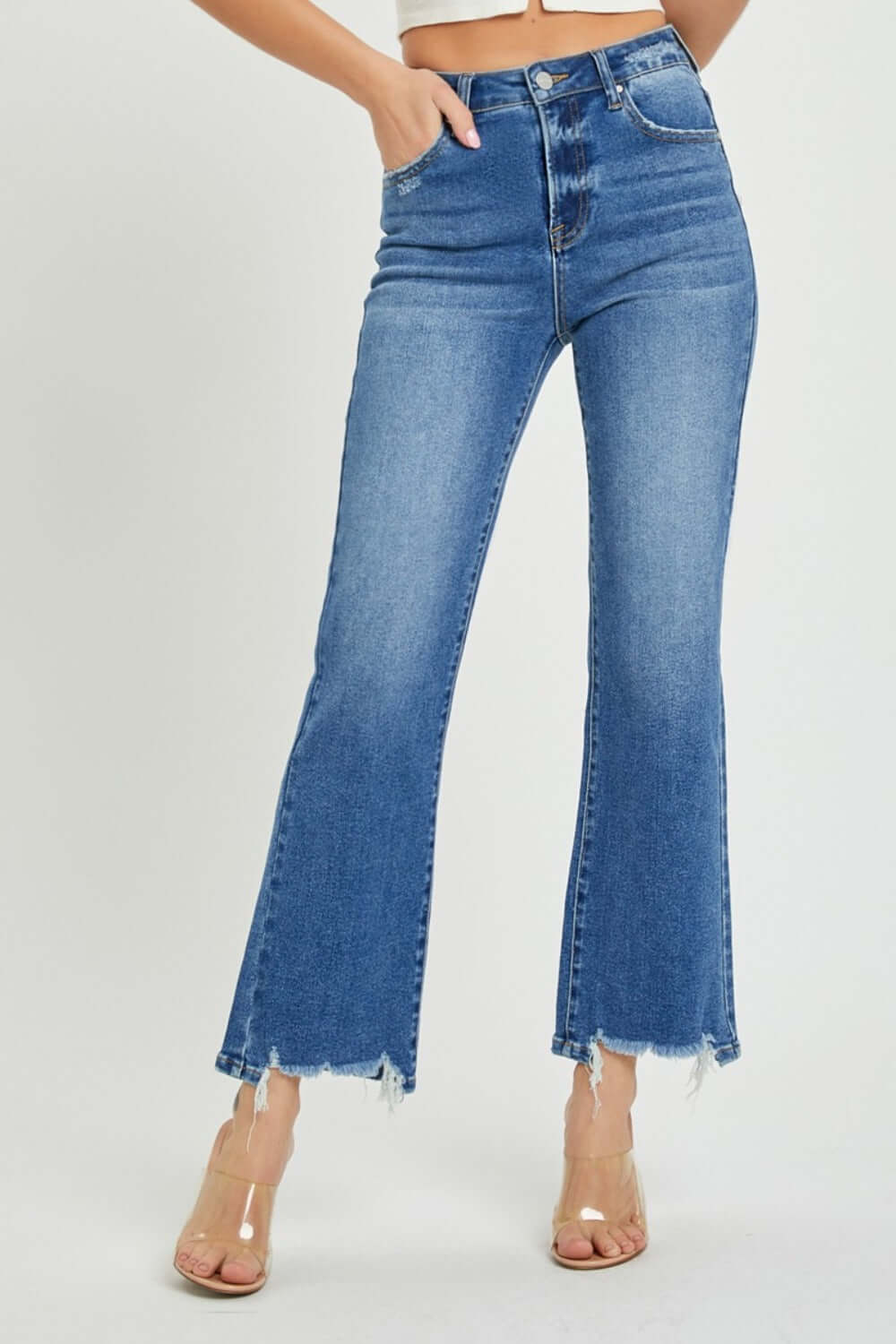 RISEN High Rise Straight Jeans with raw hem and high-rise waist for a flattering and timeless look, paired with clear high-heel shoes.