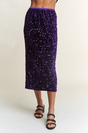 Purple sequin back slit midi skirt for glamorous outfits and special nights out.