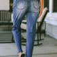 Back view of woman wearing Bella Road distressed straight jeans with pockets, slightly stretchy denim, outdoor setting.