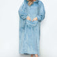 Cozy hooded midi lounge dress in soft blue, featuring pockets and a relaxed fit, perfect for chilly fall days.