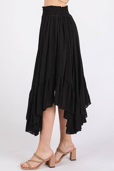 Elegant black handkerchief hem midi skirt with pockets and elastic waistband, perfect for versatile styling options.