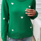 Woman wearing Devine Lace Detail Heart Long Sleeve Sweater in green with white lace collar and heart detailing