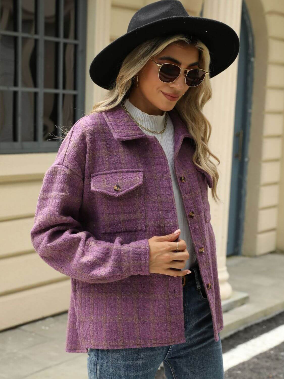 Woman wearing Bella Road Plaid Collared Neck Long Sleeve Jacket outside a building.