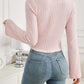 Woman wearing Bella Road Ribbed Drawstring Long Sleeve T-Shirt in pink, showing back view with slightly stretchy fabric.