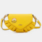 Nicole Lee USA yellow graphic crossbody bag with adjustable strap, featuring "Happy Rainbow" design.