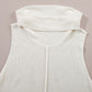 Close-up of Bella Road sleeveless white turtleneck sweater vest with a central seam detail on a neutral background.