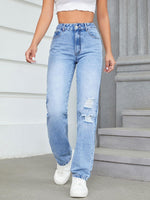 Woman wearing Bella Road Distressed Jeans with pockets and white sneakers, showcasing edgy style and comfort.