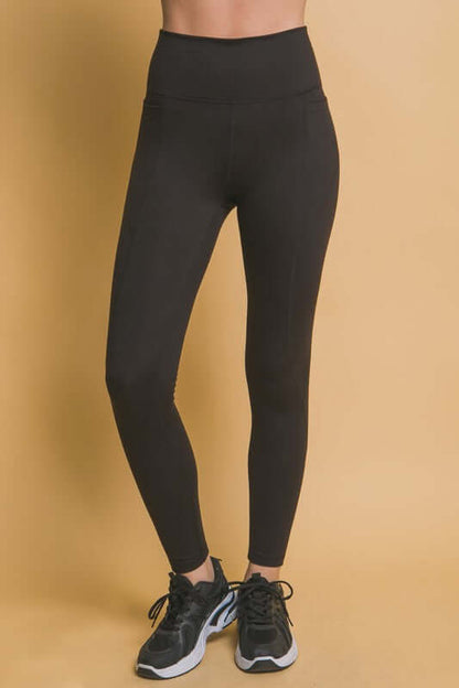 High waist black leggings with side pockets, perfect for workouts and errands, featuring a flattering design and functional style.