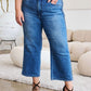 Woman wearing Judy Blue Jeans braid side detail wide leg design with heels