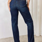 Woman wearing high-waist button-fly straight jeans by Judy Blue Jeans, crafted from premium lycra for a comfortable fit.