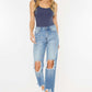 High Waist Chewed Up Straight Mom Jeans with distressed holes and frayed edges for a trendy and vintage-inspired look.