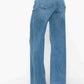 Stylish high rise wide leg jeans with pockets, showcasing a flattering fit and chic denim style.