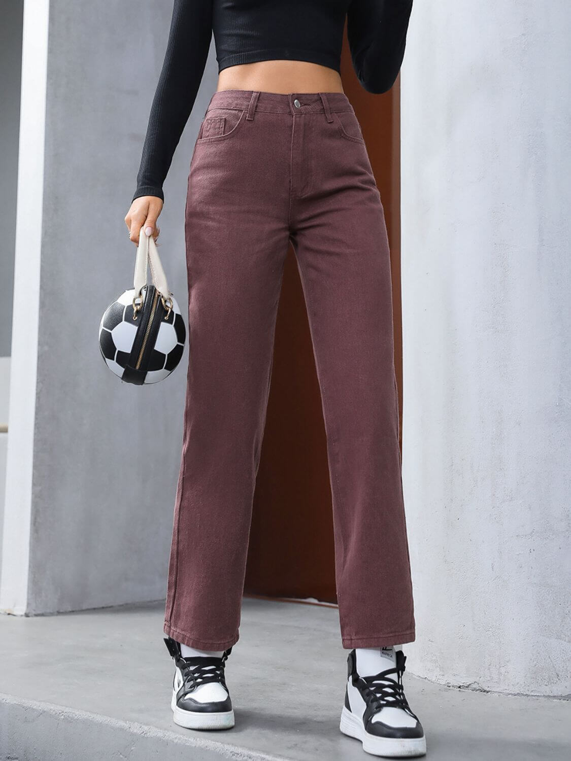 Stylish model wearing Bella Road Denim Straight Leg Jeans in dark brown with pockets, perfect for casual outings.