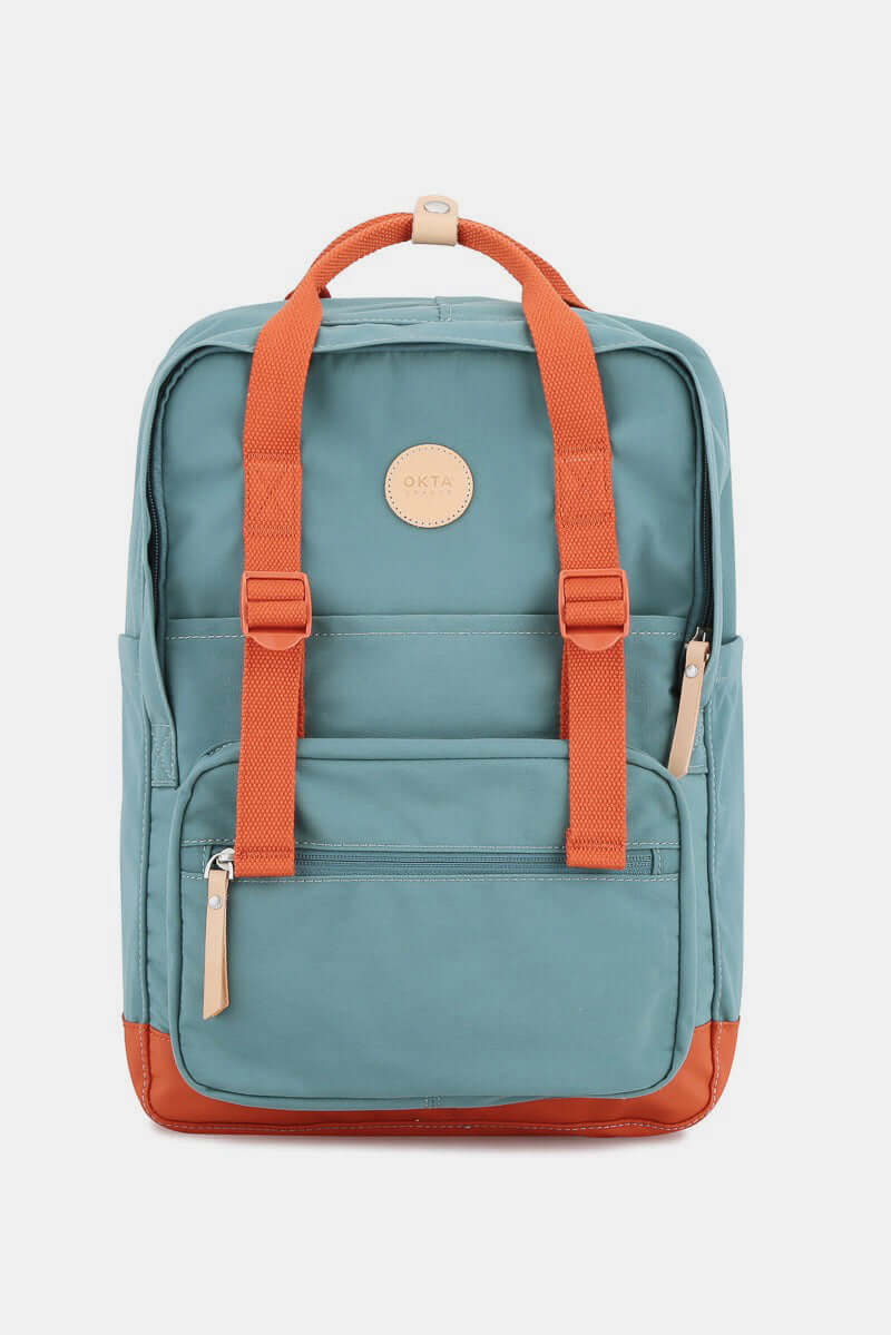 Blue waterproof canvas backpack with orange straps and side pockets for practical adventures.