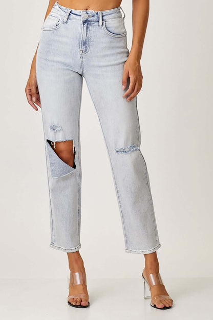 High Rise Distressed Relaxed Risen Jeans in light wash, featuring trendy ripped detailing and comfortable fit for the perfect casual look.