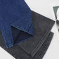 Two pairs of Basic Bae bootcut jeans in dark denim and gray, showcasing their stylish cut and versatility.