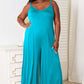 DOUBLE TAKE Full Size Soft Rayon Spaghetti Strap Tied Wide Leg Jumpsuit at Bella Road