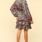 Woman in Haptics V-Neck Satin Floral Layered Dress, showcasing vibrant floral print and flowy layers, perfect for events.