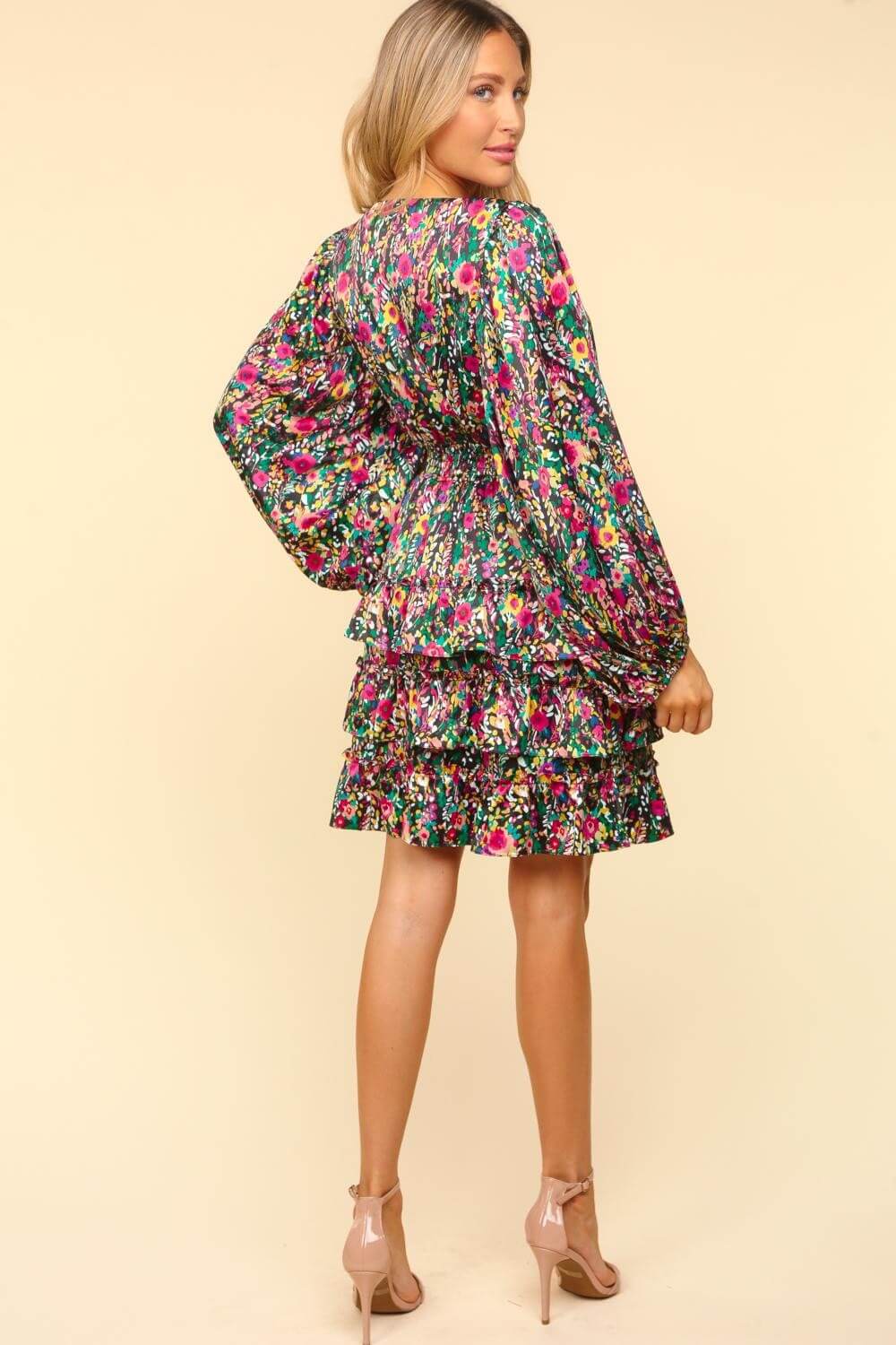 Woman in Haptics V-Neck Satin Floral Layered Dress, showcasing vibrant floral print and flowy layers, perfect for events.