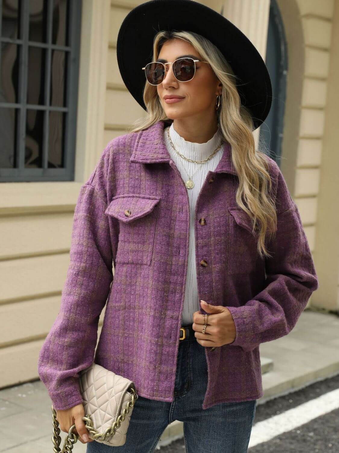 Woman wearing Bella Road Plaid Collared Neck Long Sleeve Jacket in purple with buttoned front and pockets, accessorized with black hat and sunglasses.