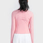 Back view of Millennia Carnation Pink Zip-Up Long Sleeve Sports Jacket paired with a white pleated skirt. Perfect for workouts!