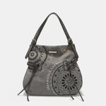 Nicole Lee USA medium vegan leather hobo bag with braided tassels, rhinestone embroidery, and adjustable shoulder straps