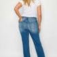 Woman showcasing bytos Raw Hem Distressed Mid Rise Straight Jeans from the back, highlighting stylish design and fit.