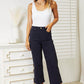 Woman wearing high waist tummy control garment dyed wide cropped Judy Blue jeans