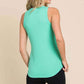 Woman wearing Ribbed Round Neck Tank in mint green, paired with black shorts, showcasing back view