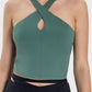 Stylish green active cami with crisscross design and unique neckline, perfect for workouts and gym sessions.