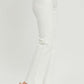 High-rise white jeans with tummy control and raw hem, styled with clear heels for a chic look.