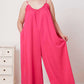 DOUBLE TAKE Full Size Ruffle Trim Tie Back Cami Jumpsuit with Pockets at Bella Road