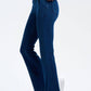 Side view of Basic Bae Pocketed Highly Stretchy Bootcut Jeans in dark blue, showcasing a stylish fit and pockets.