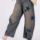 Trendy SAGE + FIG Star Wide Leg Jeans with Pockets, featuring stylish star designs and a comfortable fit.