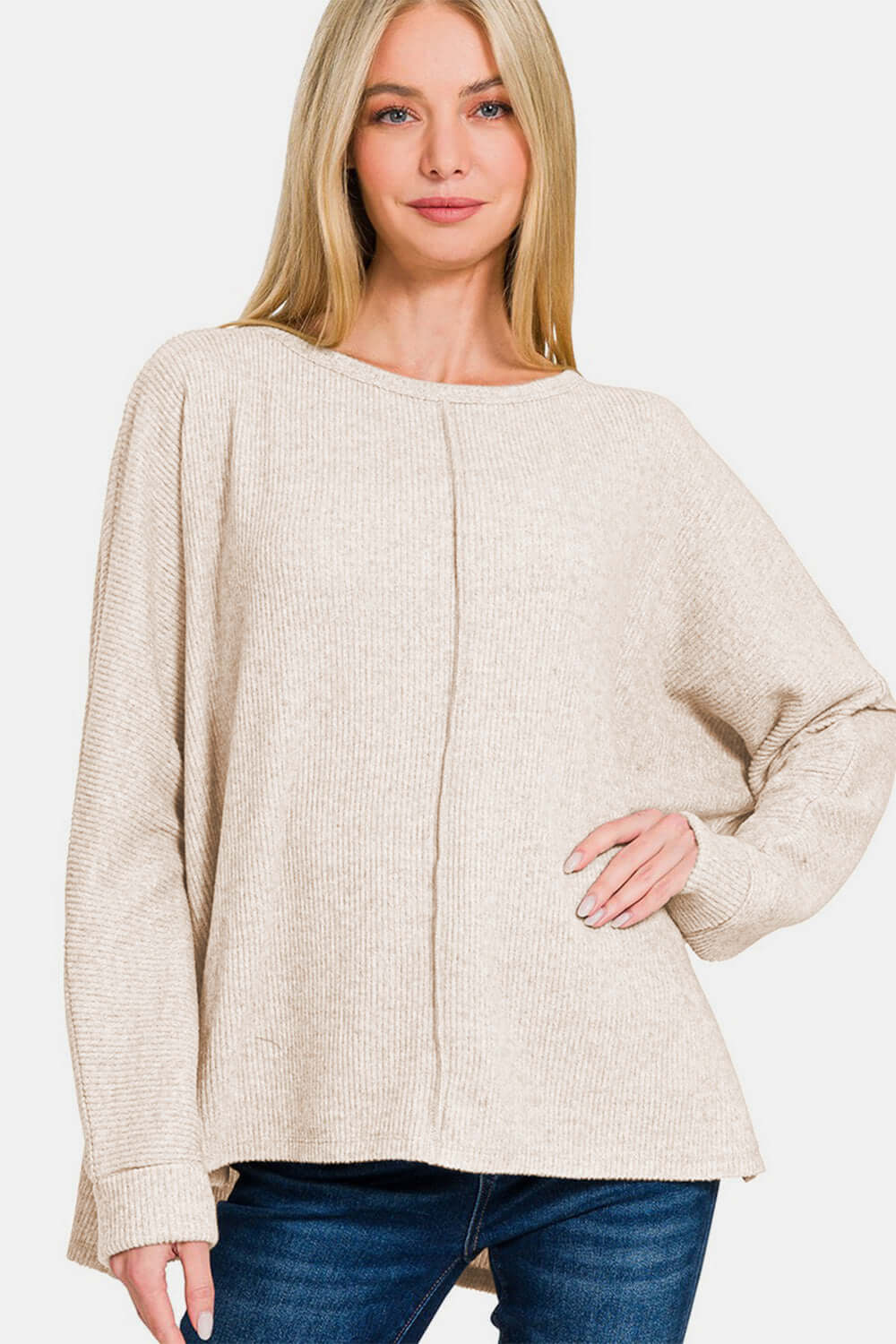 Woman modeling Zenana High-Low Side Slit Round Neck T-Shirt, showcasing modern high-low hem and stylish side slits.