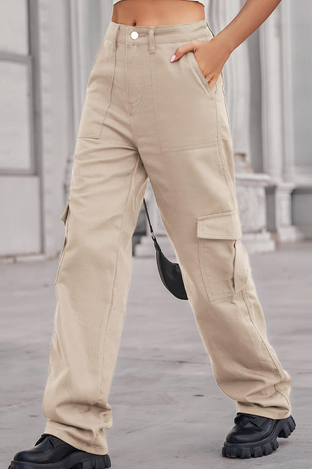 Woman wearing Baeful Long Straight Leg Jeans with Pockets in beige, displaying casual chic style.